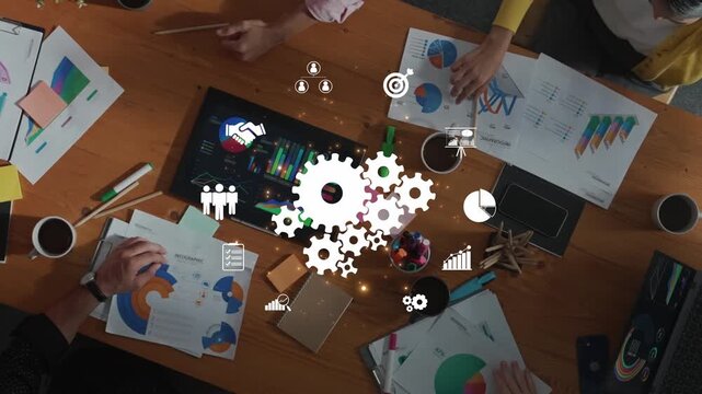 Top view of a dynamic team collaborating in an office setting, utilizing data analysis tools and creative brainstorming methods to achieve project goals and innovation. Raster