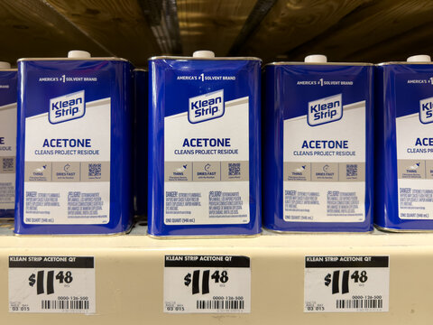 Prosper, Texas, USA - April 1st, 2026: Blue cans of Klean Strip Acetone solvent with white labels and price tags sitting on metal shelf in The Home Depot