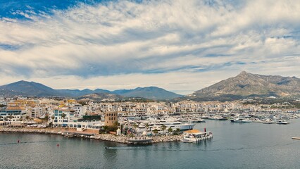 Obraz premium Puerto Banús marina aerial view, Marbella coastal harbor and beach, Costa del Sol, Spain drone panorama