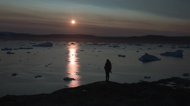 Sunset over iceberg fjord in East Greenland