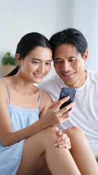 Couple using fertility tracking app on a smartphone, ovulation calendar, cycle charting, wearable sensor sync with health data, home basal temperature monitor, hormonal trend readouts, sync