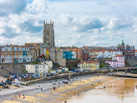 Seaside views of the holiday town of Croma on the Norfolk coast. Sandy beach and sea. Holiday destination, vintage photograph. North Sea coastline, sandy beaches, museums, surfing.