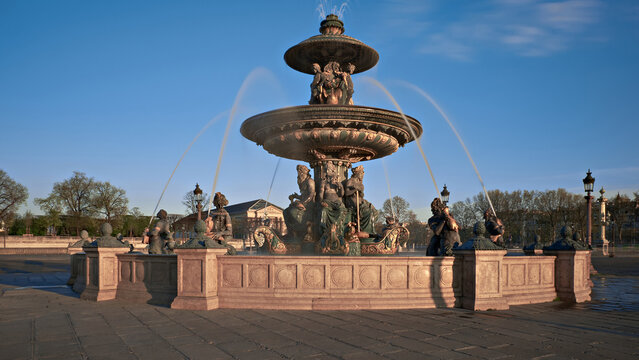 Fontaine des Mers at Place de la Concorde in Paris on clear spring morning