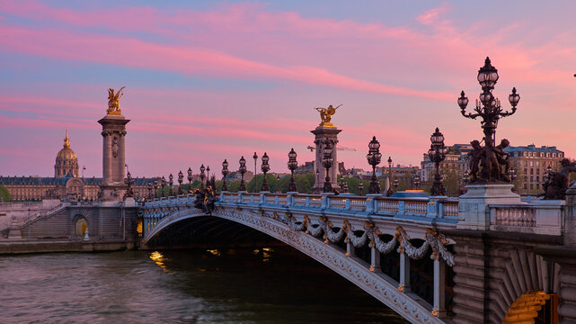 Pont Alexandre III in Paris at spring sunset with gilded sculptures and lamps