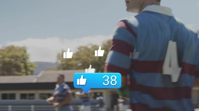 Vertical video: Like counter popping, player in rugby kit holding rugby ball on pitch, copy space