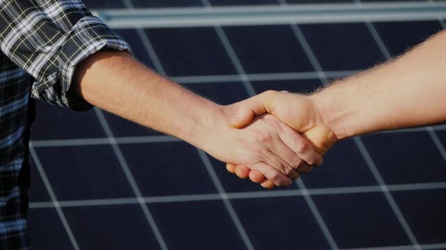 Business partnership handshake and contract signing in conference room, celebrating successful win-win collaboration video.

