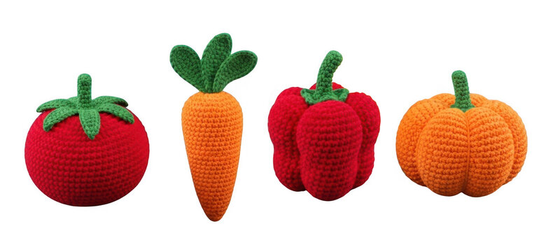 Colorful vegetable toys including tomato, carrots, capsicum and pumpkin.