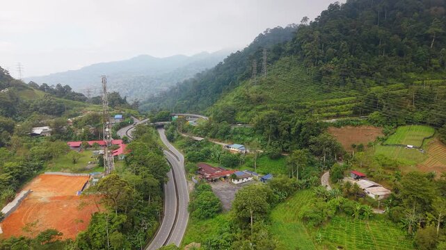 Aerial view of village houses near the Genting Sempah RnR on Karak Expressway, Malaysia 