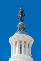 Obraz premium Statue of Freedom on US Capitol dome Washington DC blue sky detail