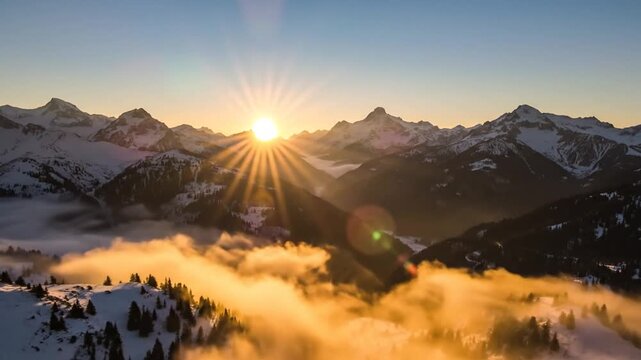 Sun Rising Over Clouds And Mountain Peaks