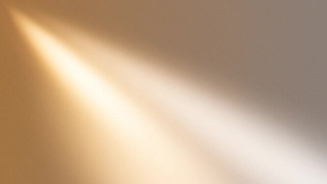 Soft golden and white light beams diagonally across a textured neutral background creating a warm and inviting