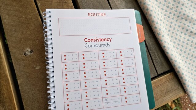 Daily Routine Planner with Consistency Compounds for Better Time Management and Personal Growth Tracking on Rustic Table