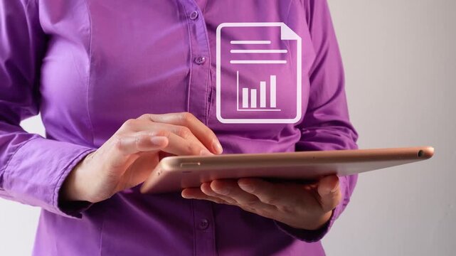 Close-up of a businesswoman interacting with her tablet, featuring an animation of various document icons.