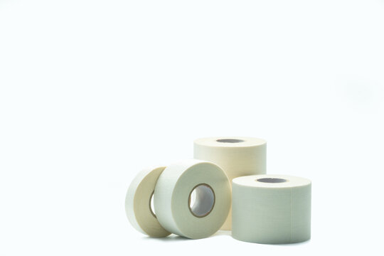 White sport tape isolated on white background. Athletic taping. Porous adhesive tape. Medical tape. Multipurpose porous tape for wound care and sprain. First aid medical supplies. Sport bandage.