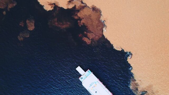 Aerial drone view of Meeting of Waters Amazon Rio Negro and Solim&otilde;es 4K