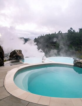 Geothermal Hot Springs with Steaming Pools and Scenic Landscape.