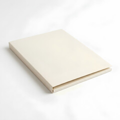 Fototapeta premium Closed white book on a white surface minimalist design.