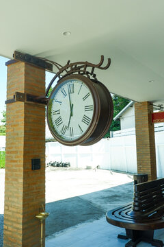 Retro Large decorative clock hanging from a train station,vintage old style,classic public clock in railway station subway central train station, watch time waiting train concept.