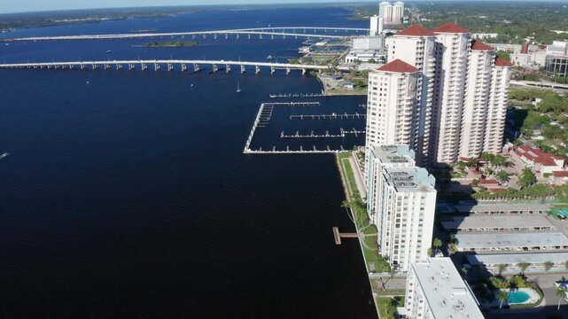 Panoramic view of high-rise condos and bridges over the Caloosahatchee River in Fort Myers. Ideal for real estate promos and travel content.