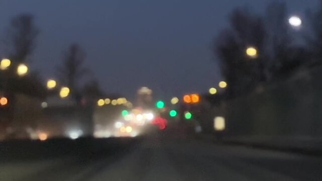 Night driving on a dark highway with blurred taillights, passing cars, and a moody low-light atmosphere captured from inside a moving vehicle. High quality FullHD footage