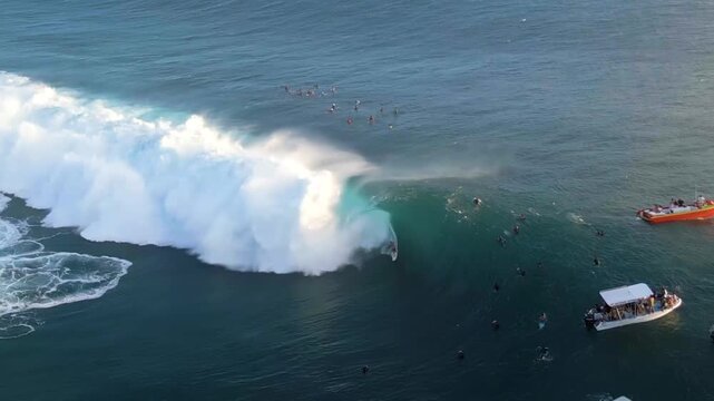 surfer riding famous wave of teahupoo, tahiti