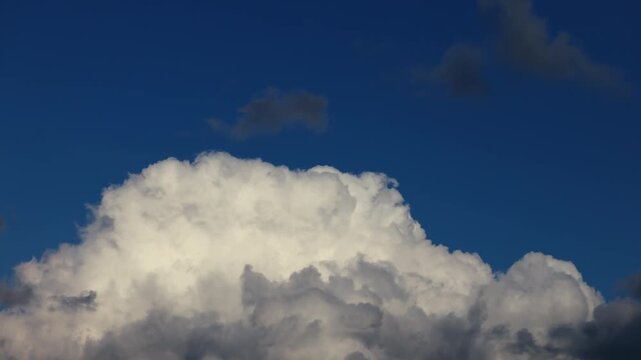 Timelapse of dark storm clouds moving rapidly running across the sky , dramatic atmospheric buildup with dense thundercloud formations signaling approaching severe weather and hurricane season