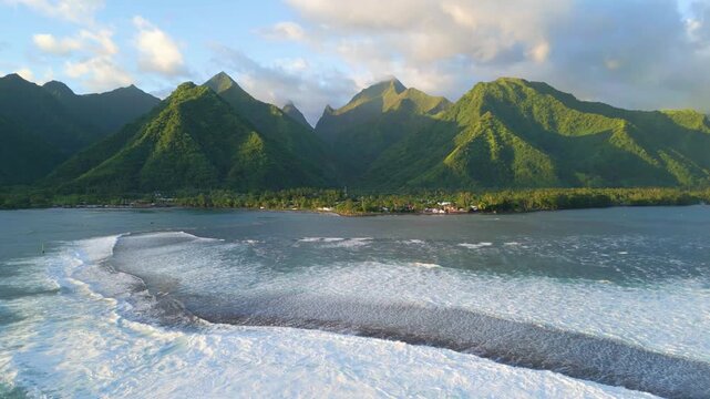 mountains of teahupoo in tahiti, view from beyond the reef