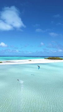 Kite surfer in paradise, tropical lagoon kitesurfing destination Aitutaki, Cook Islands