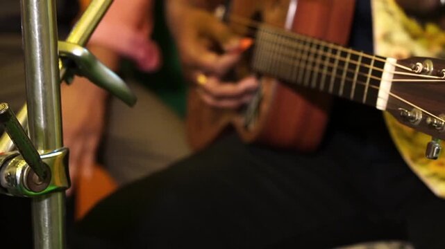 Detailed shot of a guitarist from a contemporary Indian band performing at a music festival, showcasing modern South Asian youth culture.