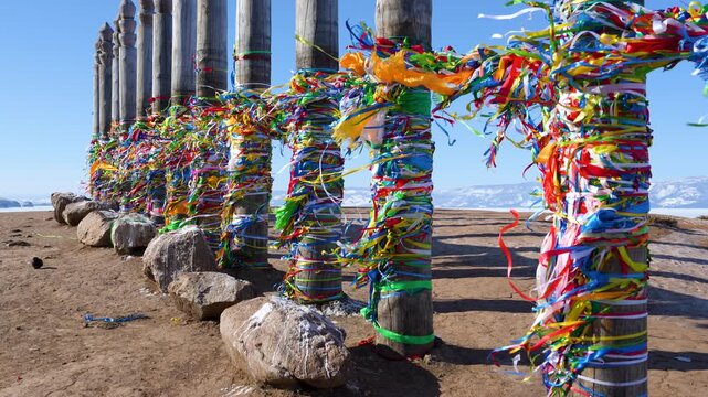 Shaman Rock totem poles on clifftop at Cape Burkhan, Olkhon Island, Lake Baikal