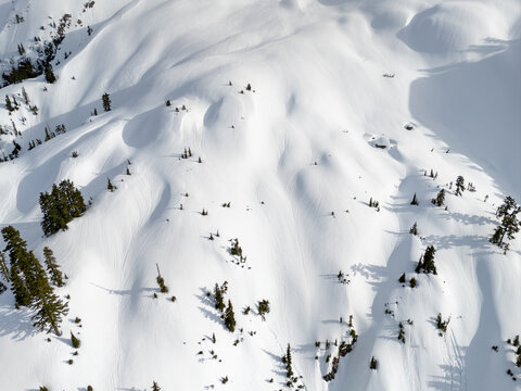 Aerial Snow-Covered Mountain Slopes in Winter Light, British Columbia, Canada &mdash; Pristine Alpine Landscape