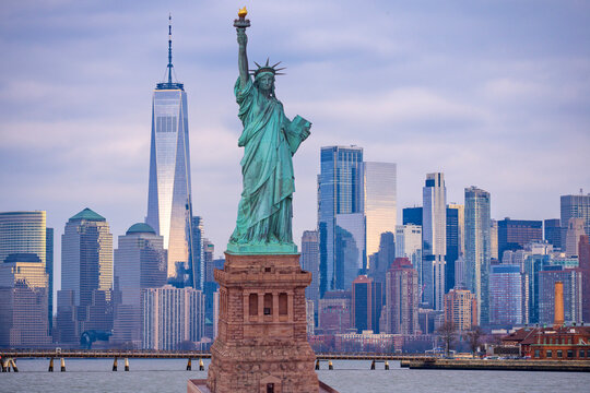 American vote and democracy. Manhattan by the Statue of Liberty. Elections in USA. New York City skyline with Liberty Statue. Manhattan skyscrapers near Statue of Liberty. Symbol of Freedom in USA.