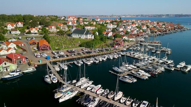 Drone perspective of Fiskeb&auml;ckskil coastal village with traditional wooden houses and yacht harbor on Skaft&ouml; island in Bohusl&auml;n archipelago