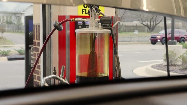 Oil Recycling Pump and Used Oil Collection Tank at Service Station