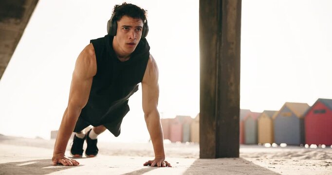 Fitness, push up and man with music outdoor for exercise, bodybuilder training and workout. Athlete, nature and person with audio, radio and headphones for active hobby, strength and strong muscle