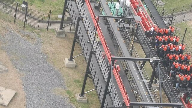 People Riding a Large Rollercoaster From an Aerial View