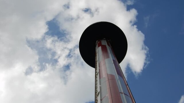 Rollercoaster Ride Drops From High Point on Cloudy Day