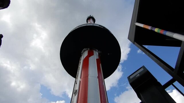 Rollercoaster Tower Ride Goes up Into the Sky on a Cloudy Day