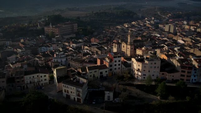 Footage of Espluga de Francoli town in Catalonia with sunrise and mountains in the back. High quality 4k drone footage
