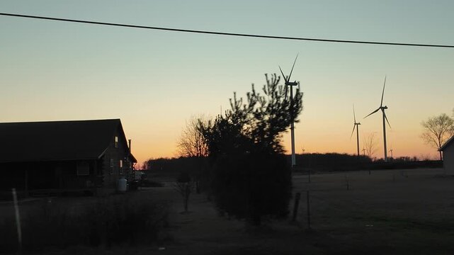 Wind Turbines at Sunset Over Farmhouses in Ohio