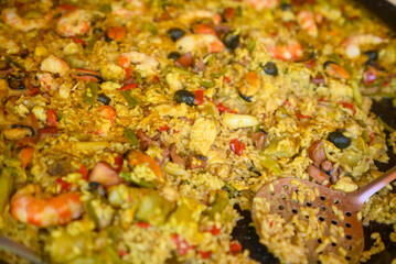 Close up of mixed paella cooking in flat pan The Concept of Culinary Feast