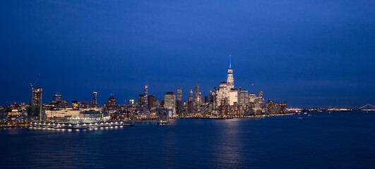 NYC night skyline with Manhattan. New York City aerial view of Manhattan. New York City, Manhattan skyline. New York panoramic cityscape. New York City Hudson skyline. NYC metropolis aerial view.