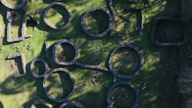Circular Stone Foundations At Castro de Borneiro - Iron Age Fortified Settlement In Galicia, Spain. aerial topdown shot