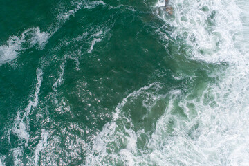 Aerial view of crashing waves The Concept of Power