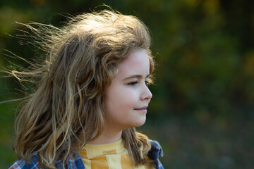Kid closeup portrait blonde child. Kid outdoor nature sunlight warm. Kid playful imagination...