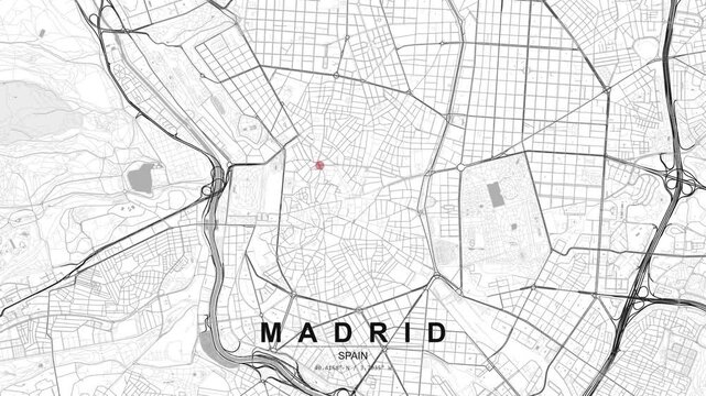 Detailed map of Madrid, Spain showing a dense street grid and road network with a red location pin marking a central urban area