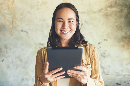Smile, search and portrait with woman and tablet for streaming, ebook app or social media. Digital library, chapter release schedule or connection with person on wall background for author notes