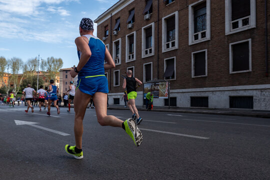 Group runners athletes running marathon race in Palazzo dell'Anagrafe Rome