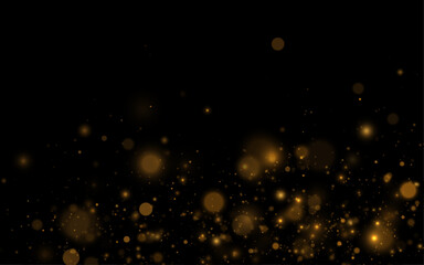Golden sparkles drift on transparent background. Soft glowing dust forms elegant texture. Perfect festive luxury overlay design light. © dedstock