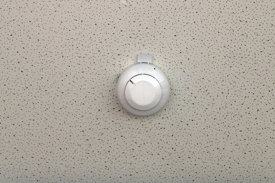 smoke detector installed on indoor ceiling